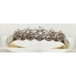 An 18ct gold ring with diamonds in a platinum setting, 2.4g, size K