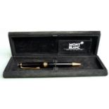 Montblanc ballpoint pen with black resin barrel and cap, gilt fittings and star cap