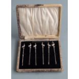 Cased set of six cocktail sticks with cockerel finials marked Sterling silver