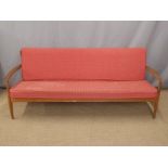 France and Co retro Danish teak sofa with original red geometric design cushions, length 197cm