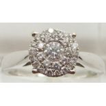 An 18ct white gold ring set with a cluster of diamonds, total approximately 0.5ct, 4.8g, size P