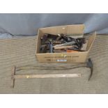 A collection of largely woodworking tools including adze, t-square, chisels etc