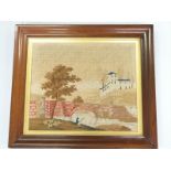 A 19thC wool embroidery of a man fishing by a bridge, in Regency rosewood frame