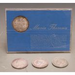 Maria Theresia cased coin together with three silver crowns 1896, 1935 and 1937