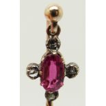 Victorian stick pin set with an oval pink sapphire and rose cut diamonds