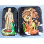 Two Russian lacquer boxes, one depicting a lady in traditional dress (approximately 5cm x 10cm x 2.