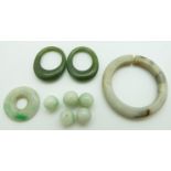 Two nephrite jade rings, jade disc, jade ring and jade beads