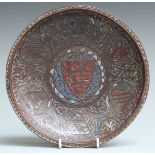 A 13thC French copper and polychrome champlevé enamel gemellion of typical shallow dished form,