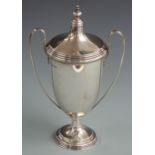 Mappin & Webb George V hallmarked silver twin handled lidded trophy cup with inscription relating to