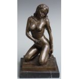 A bronze model of a nude lady kneeling, set on marble plinth, approximately 32cm tall