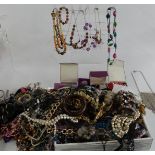 A collection of costume jewellery including glass pendants, necklaces etc