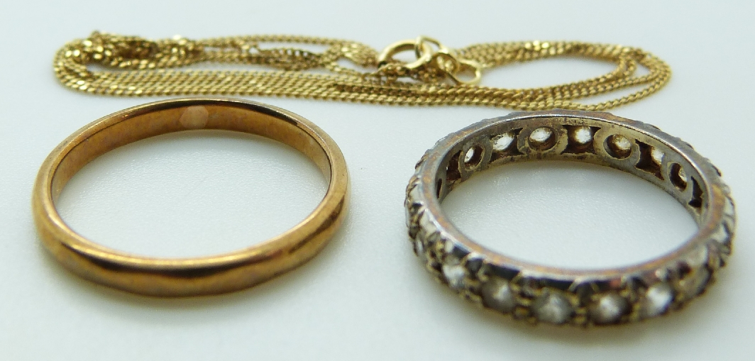 A 9ct gold chain, 9ct gold eternity ring and 9ct gold ring, 5.2g