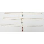Three 9ct gold necklaces, two set with topaz and diamonds the other with synthetic rubies and