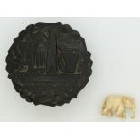 A carved Irish jet box depicting harps, shamrocks from Killarney and an ivory elephant