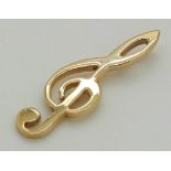 A 9ct gold pendant in the form of a musical note, 2.2g