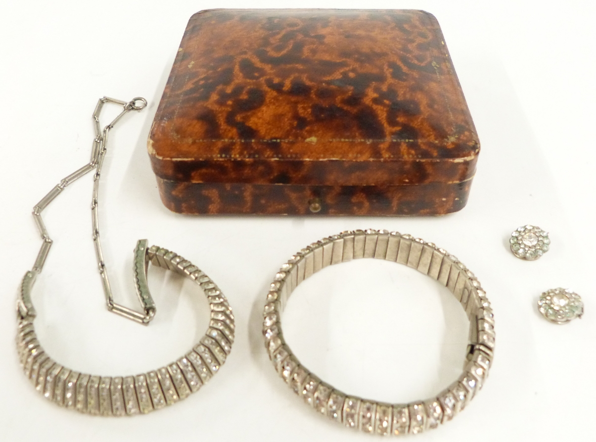 A suite of Art Deco paste jewellery comprising earrings, necklace and bracelet