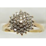 A 9ct gold ring set with a cluster of diamonds, 2.7g, size O
