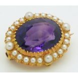 Edwardian brooch set with an oval cut amethyst surrounded by pearls, 2 x 1.8cm