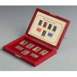 'The Coronation Issue' cased set of seven hallmarked silver gilt coronation stamps, weight 170g