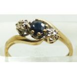 A 9ct gold ring set with a sapphire and two diamonds, 2.0g, size L
