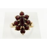 A 9ct gold ring set with garnets, 3.3g, size M