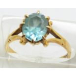 An 18ct gold ring set with an oval cut zircon, 4.0g, size P