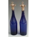 Pair of Victorian Bristol blue glass decanters with hallmarked silver mounts and stopper,