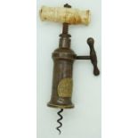 Victorian Heeley & Sons side action corkscrew with bone handle and set with royal coat of arms.