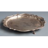 Edward VII hallmarked silver salver with shaped edge and raised on three feet, London 1909 maker