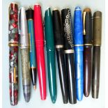 Ten fountain pens and propelling pencils.