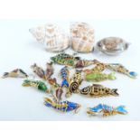 A quantity of enamel fish pendants, quartz pendant and two shell containers