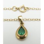 A 9ct gold necklace set with a pear cut emerald, 2.9g