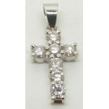 COLLECTING An 18ct white gold cross pendant set with seven diamonds each approximately 0.12ct