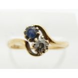An 18ct gold ring set with a sapphire and diamond, 2.4g, size K