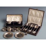 Cased pair of hallmarked silver salts, cased set of six hallmarked silver teaspoons, pair of feature