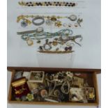 A collection of costume jewellery including 9ct gold watch back, rings, beads, watches, silver