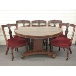 Victorian mahogany breakfast table and five chairs with carved decoration and turned front legs