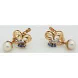 A pair of 9ct gold earrings set with a pearl to each, 3.6g