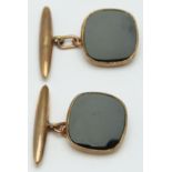 A pair of 9ct gold cufflinks set with black enamel, 6.1g