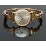 Omega 9ct gold wristwatch ref. 511.5137 with black hands, gold Arabic numerals, silver dial and
