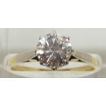 An 18ct gold ring set with a round brilliant cut diamond measuring approximately 1.2ct, 3.1g, size