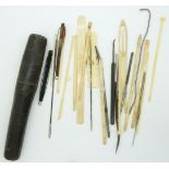 19thC sewing set in tubular case, comprising needles, hooks etc, length of case 20cm