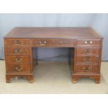 Twin pedestal desk having leather or similar inset top, fitted eight variously sized drawers, W152 x