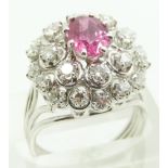 French 18ct white gold ring set with an oval ruby measuring approximately 1.3ct surrounded by