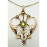 Edwardian 9ct gold pendant set with a peridot and seed pearls, 3.2g