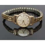 Omega 9ct gold ladies wristwatch ref. 511/5002 with gold hands and Arabic numerals, silver dial