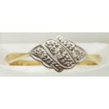 An 18ct gold ring set with diamonds in a platinum setting, 1.4g, size J
