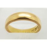A 22ct gold ring/ wedding band, Birmingham 1919, size J, 5.3g.