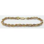 A 9ct gold tri-coloured bracelet, 6.9g