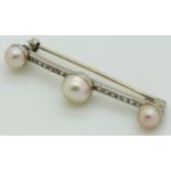 A platinum brooch set with three pearls and rose cut diamonds, length 4.5cm